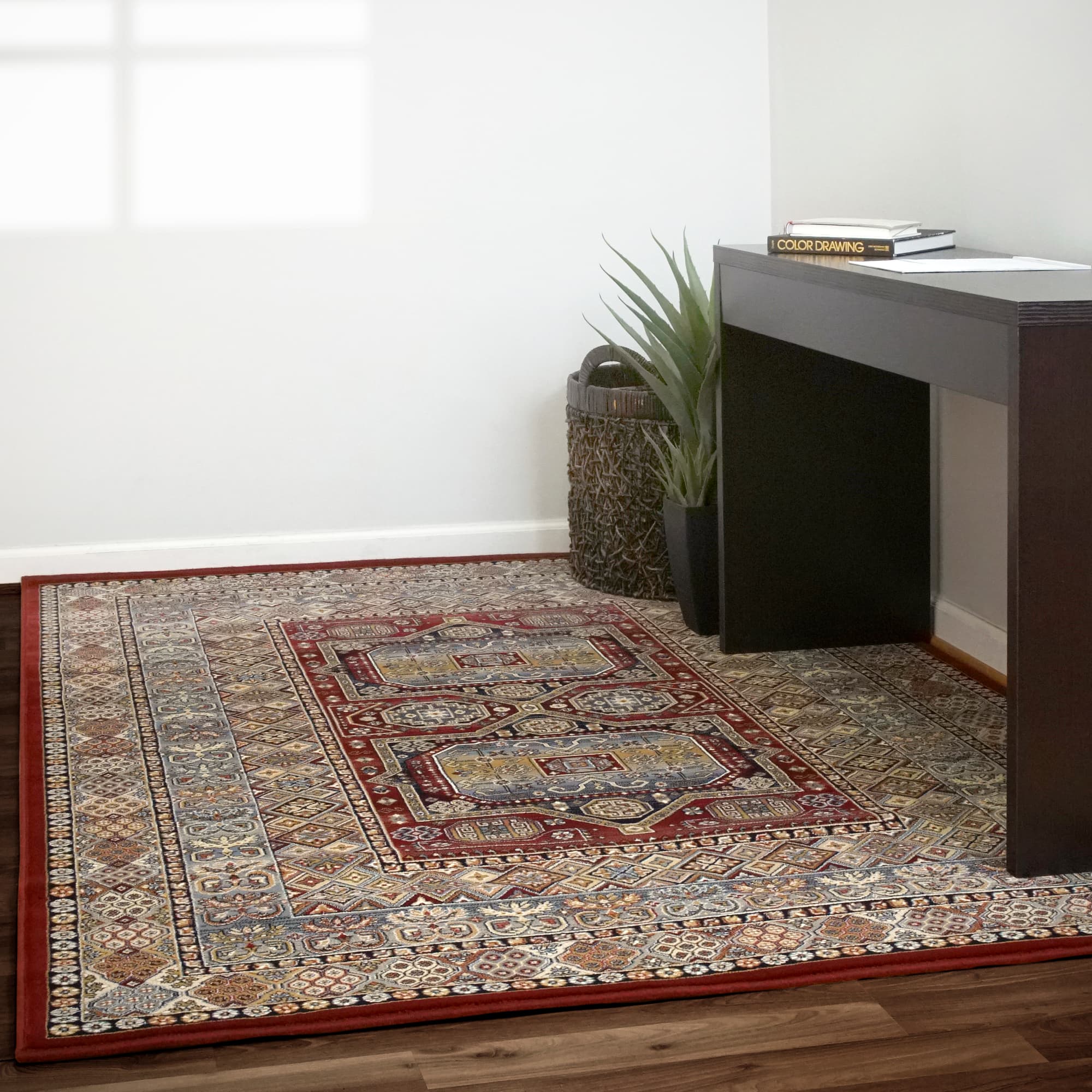 Cedar, an Ancient Garden heatset polypropylene rug in red, styled in a room